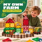 Kind baut einen Bauernhof mit Magnetic Tiles Farmyard Frenzy